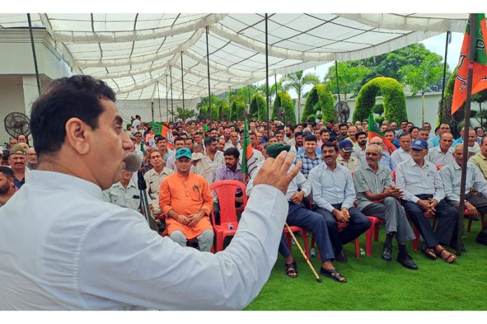 BJP leader, Rajiv Jasrotia addressing a public rally in Kandi belt area of Jasrota on Tuesday.