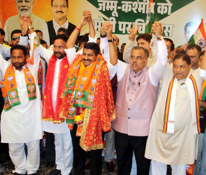 Leading businessman and a well known social activist Gaurav Gupta posing with Union Minister, G K Reddy, BJP national general secretary, Tarun Chugh and party working president, Sat Sharma after joining party at Jammu on Thursday. -Excelsior/Rakesh