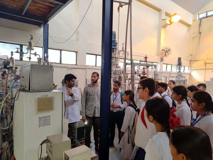 A scientist briefing school students on R&D activities at IIIM Jammu on Thursday.