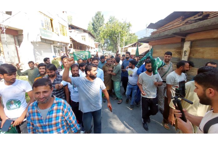 PDP leader Waheed ur Rehman Parra canvassing for party candidate Bashir Mir in Ganderbal on Friday.— Excelsior/Firdous