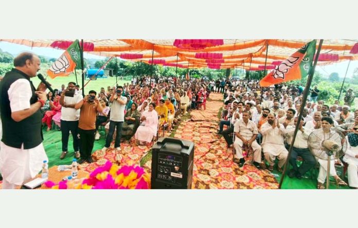 Senior BJP leader Surjeet Singh Slathia addressing a public rally in Vijaypur on Sunday.