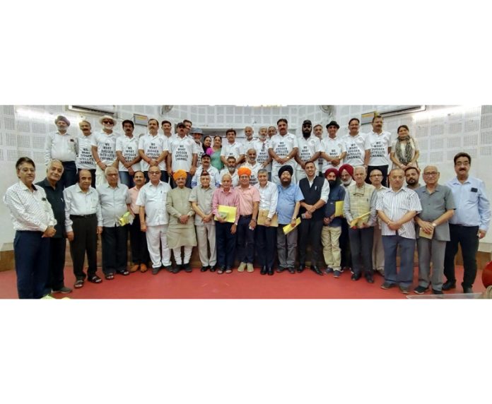 Dignitaries posing for a group photograph during a function organized in Jammu on Tuesday.