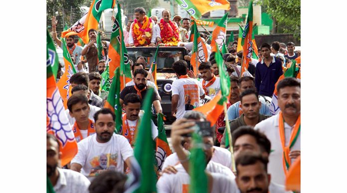 Sr BJP leaders Jugal Kishore Sharma and Devender Singh Rana during a public rally.