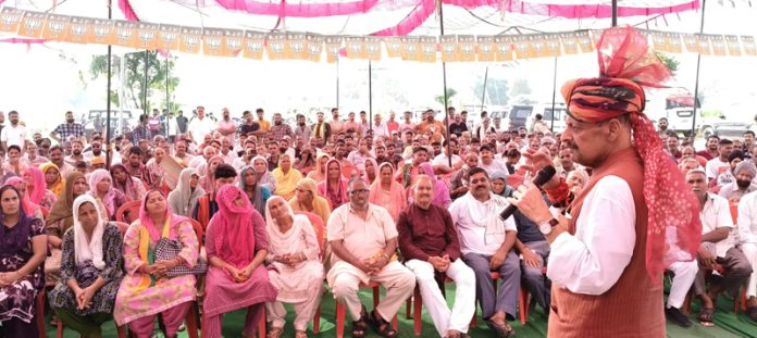 Senior BJP leader Devender Singh Rana addressing election meeting.