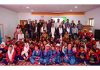 Justice Tashi Rabstan along with others posing with children of the school.