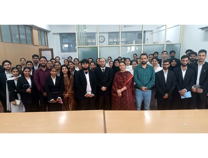 Students of The Law School (JU) with faculty members in a court room at High Court complex, Janipur, Jammu.