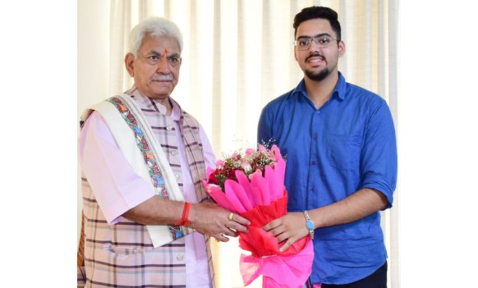 Sahaj Sabharwal posing along with LG Manoj Sinha in Jammu on Tuesday.