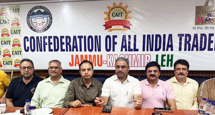 CAIT President Neeraj Anand addressing media persons in Jammu on Friday.