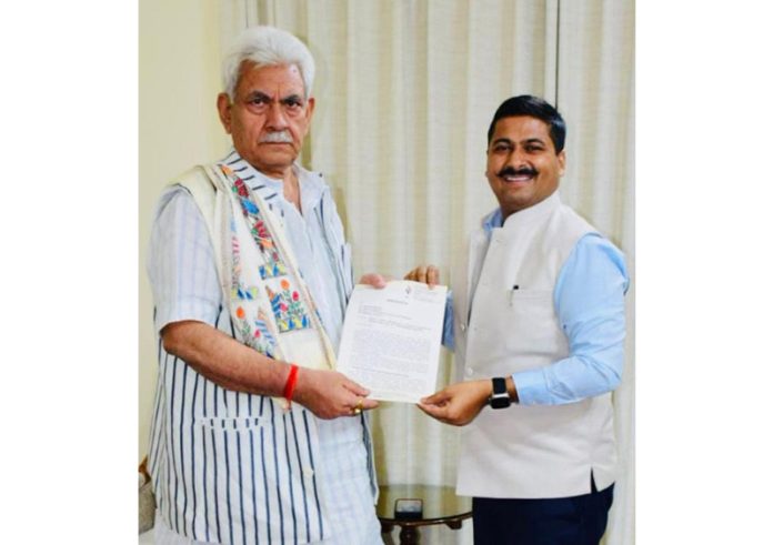 General secretary of CCI Jammu, Gaurav Gupta, presenting a memorandum of demands to LG Manoj Sinha.