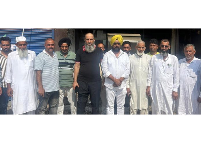 Taranjit Singh Tony, General Secretary of JKPCC, poses with others during a rally in Jammu on Thursday.