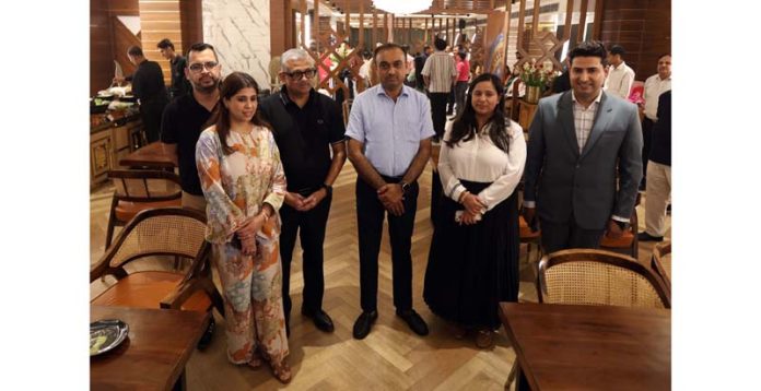 Divisional Commissioner Jammu, Ramesh Kumar posing with proprietor of Sanjeev Caterers and others at newly opened restaurant 