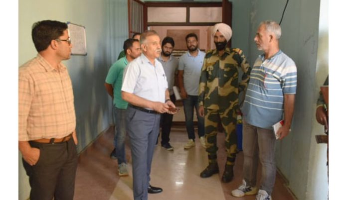 DEO Bandipora Manzoor Ahmad Qadri inspecting polling station on Monday.