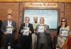 LG Mishra releasing booklets during a function in Leh on Thursday.