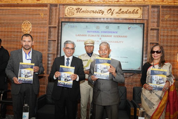 LG Mishra releasing booklets during a function in Leh on Thursday.