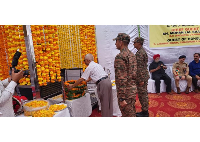 A dignitary paying floral tribute to Lt Thakur Dass Sharma in Akhnoor on Friday.