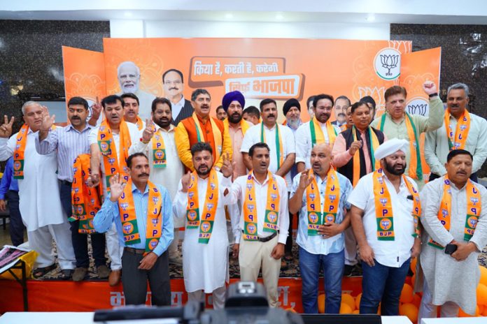 Ex BDC Chairman, former Sarpanchs and Panchs posing for a photograph with Union Minister, G K Reddy and senior BJP leaders after joining party at Jammu on Sunday.