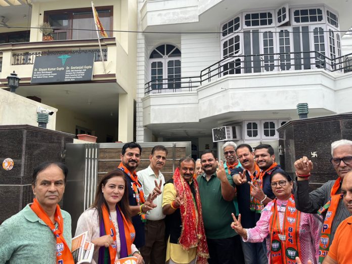 BJP candidate from Bahu constituency Vikram Randhawa during campaigning in his constituency on Thursday.