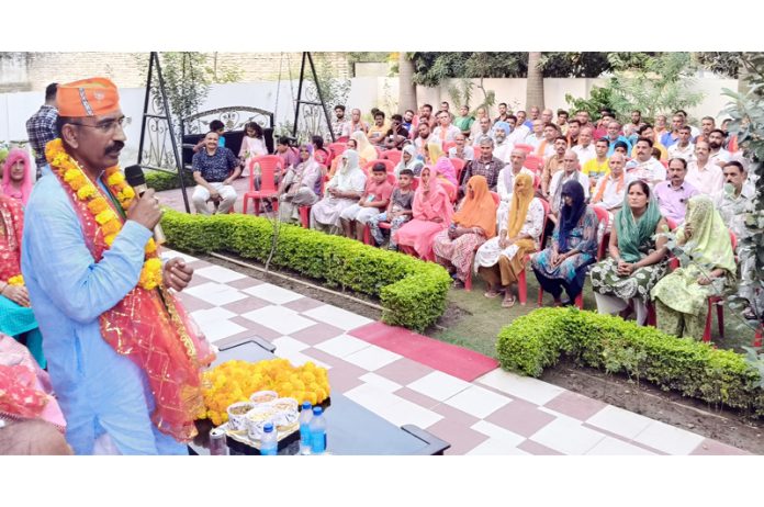 BJP Akhnoor candidate, Mohan Lal Bhagat addressing a gathering at Jourian on Thursday.