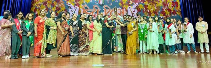 Student and teachers from different schools posing for a group photograph during an event in Abu Dhabi.