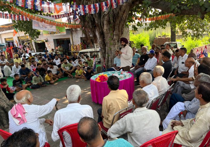 Apni Party candidate Manjit Singh addressing a public meeting in Vijaypur on Tuesday.