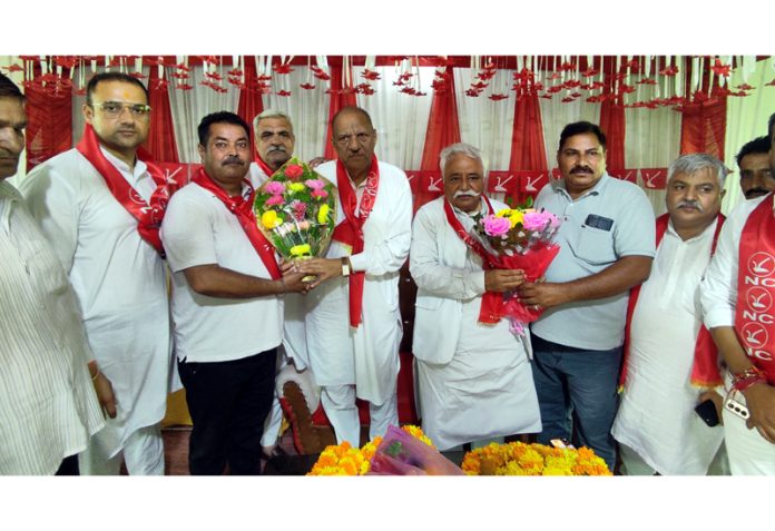 Cong & NC leaders Mula Ram and Ajay Sadhotra during an election rally in Marh on Friday.