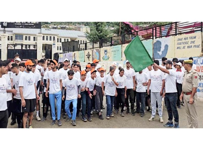 Officers flagging off Mini-Marathon at DC Office Complex Kishtwar on Wednesday.