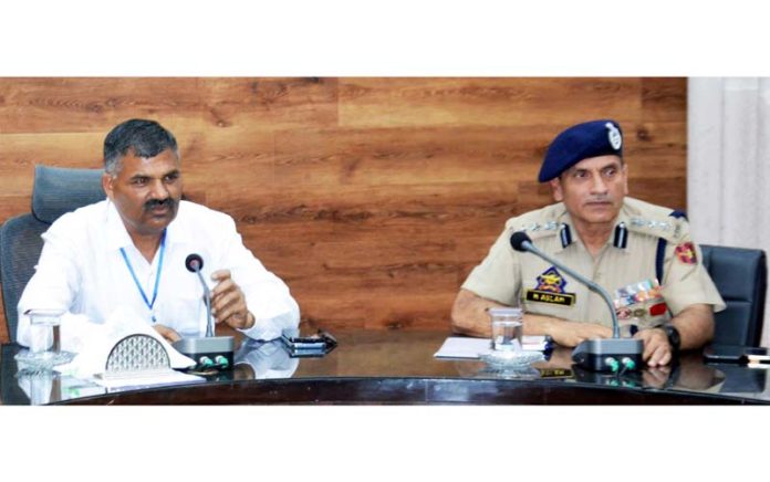 Police Observer Dharmveer Singh chairing a meeting on Wednesday.