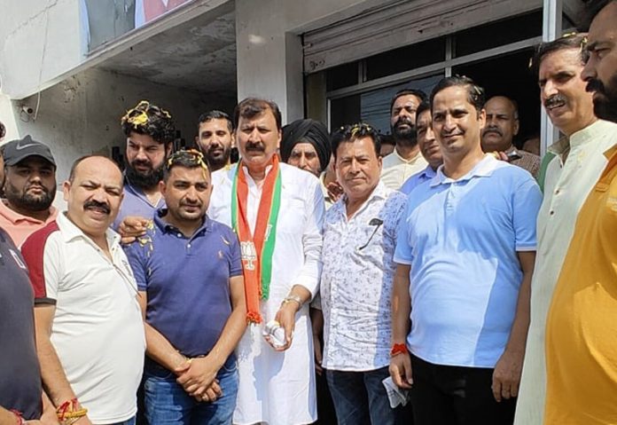 BJP candidate from Jammu West Assembly segment, Arvind Gupta with his supporters at Talab Tillo, Jammu.