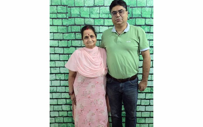 Dr Vikas Padha with patient who walked comfortably after three joint replacement surgeries.