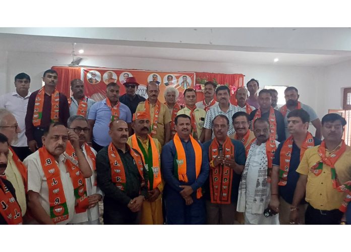 Rakesh Mahajan, Incharge of all BJP Cells posing along with the officer bearers of various cells in Akhnoor on Thursday.