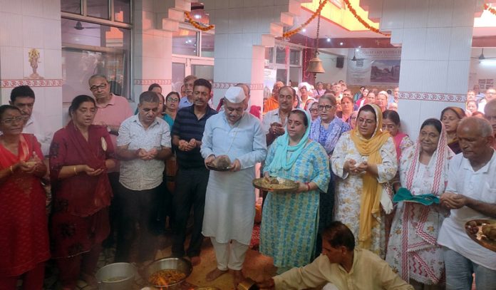 Devotees participating in a religious function at Mata Roopa Bhawani Temple Talab Tillo.