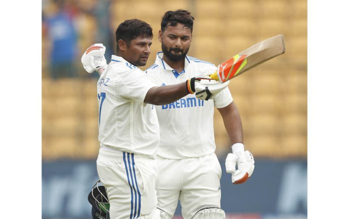 India's Sarfaraz Khan celebrates his century during the fourth day of the first test cricket match between India and New Zealand at M Chinnaswamy Stadium, in Bengaluru on Saturday. UNI