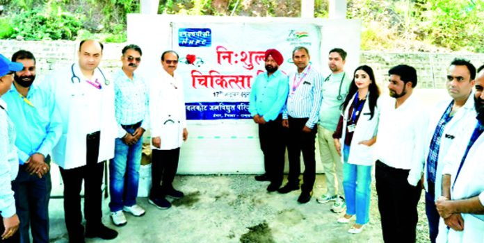 D Boral, GM (Civil) Sawalkote posing along with others during a medical camp in Jammu on Friday.