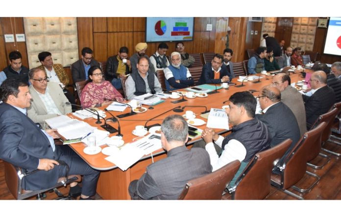 Minister for Agriculture Production Javed Ahmed Dar chairing a meeting in Srinagar.