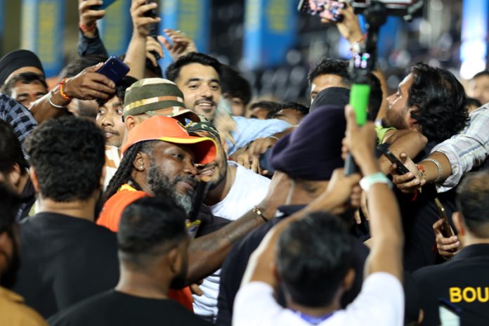 Fans taking slefies with star cricketer Chris Gayle at Jammu on Monday.