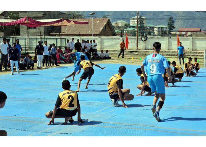 Kho-Kho players in action during a tournament at Kishtwar on Friday.