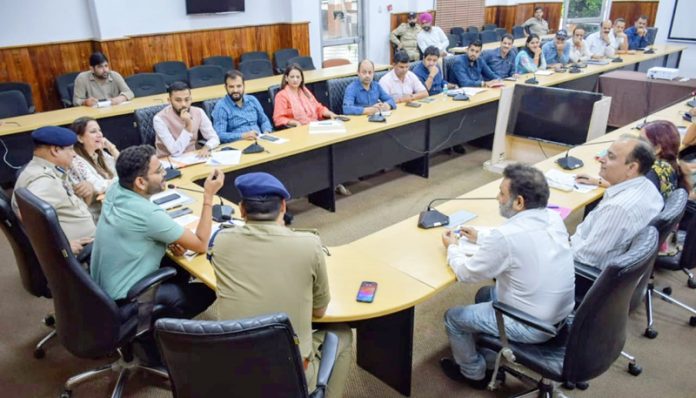 DM Sachin Kumar Vaishya chairing a meeting on Friday.