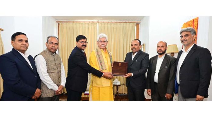 CEO P K Pole along with others submitting a copy of notification to LG Manoj Sinha in Raj Bhawan on Thursday.