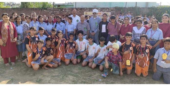 Players posing along with dignitaries during prize distribution ceremony of 7th Jammu District Tennikoit Championship at Jammu.