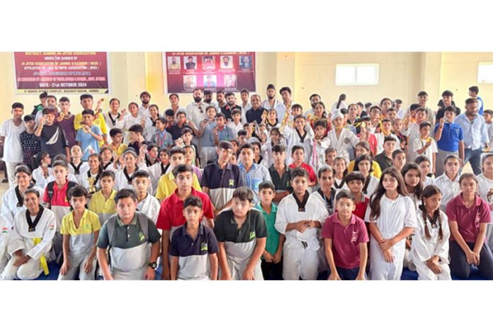 Athletes posing along with dignitaries during 12th District Jammu Ju-Jitsu Championship at Jammu.