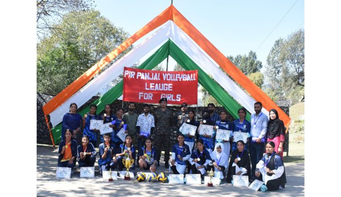 Girls posing along with Army officers during an event at Rajouri.