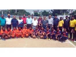 Players posing along with dignitaries during tournament.