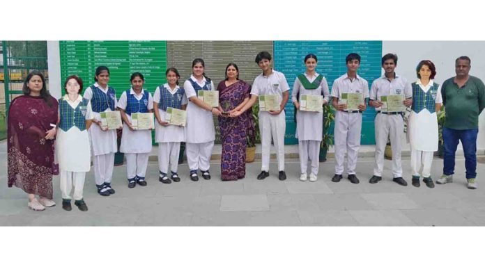 Students of DPS Jammu posing along with staff members.