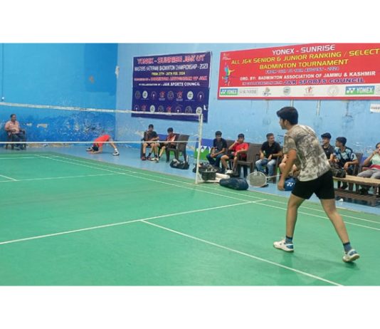 Badminton players in action during selection trials at Jammu.