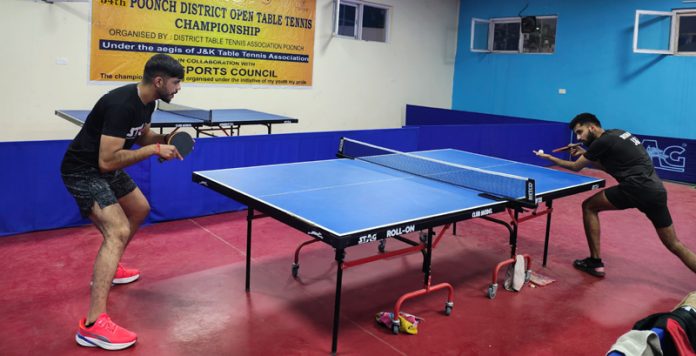 Table Tennis players in action during a match at Poonch.