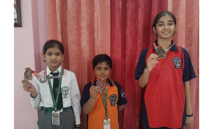 Students of DPS Jammu display Gold medals they won at Invitational North India Open Karate-Do Championship 2024.