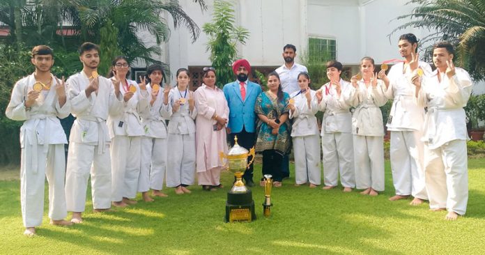 Players from J&K Blind and Para Judo Association posing for a group photograph with others after winning 3rd Visually Impaired Youth National Judo Championship.