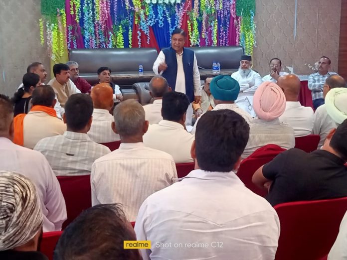 Congress leader Ravinder Sharma interacting with party leaders in Samba on Monday.