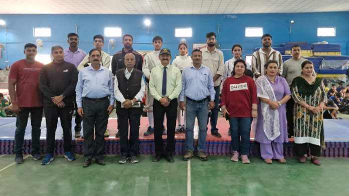 Fencers along with others pose for a group photograph on Day 1 of 14th Udhampur District Fencing Championship.