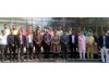 Justice Atul Sreedharan posing for photograph with students and faculty members at KU.